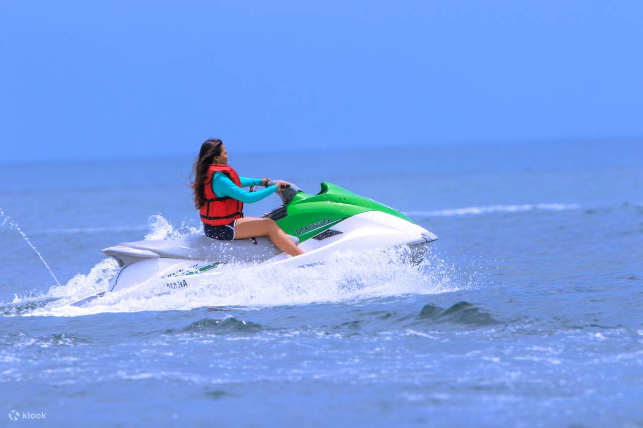 jet ski riders making a splash